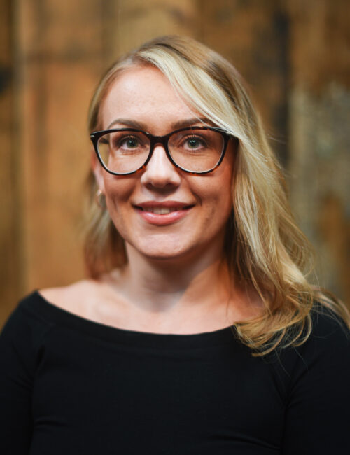 A headshot image of Collette Hodgetts smiling towards the camera.