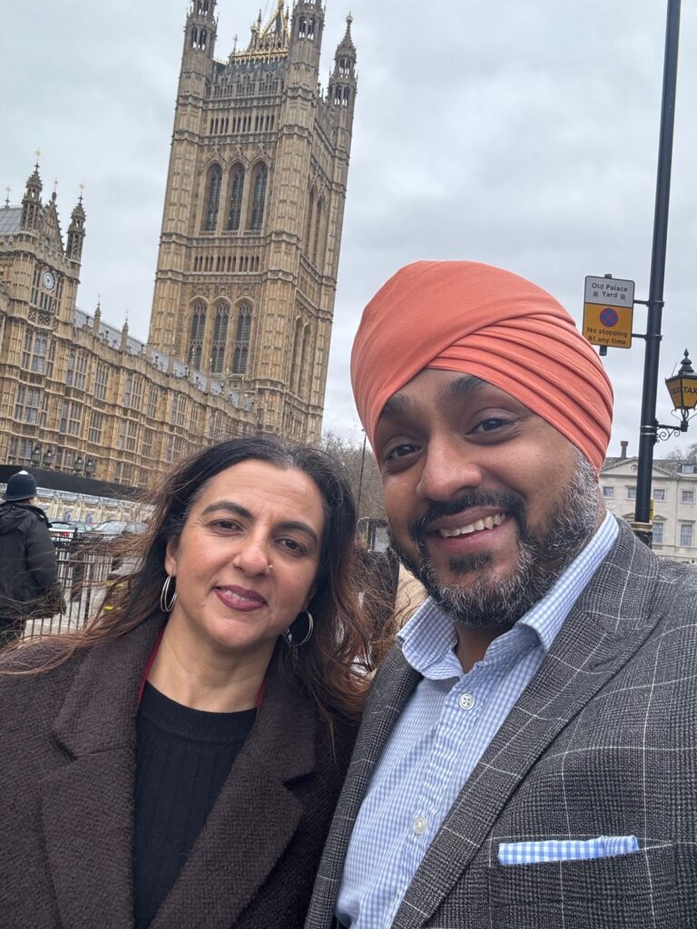 Monica Shafaq and Harj Gahley pose in from of the Elizabeth Tower at the House of Lords.